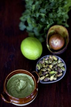 there are some fruits and vegetables next to each other on the table, including limes