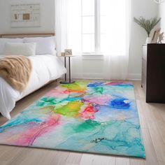 a colorful area rug in a white bedroom