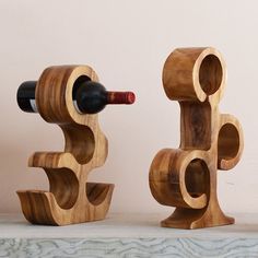 two wooden wine racks with bottles in them