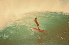 a person riding a surf board on a wave