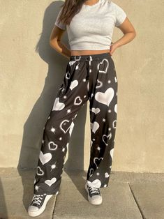 cozy up in these all-over print airbrush hearts pajama pants. made of a soft light-weight fabric and fits a straight-leg silhouette, they are perfect for everything from daily errands to those laid-back nights! 96/4 polyester/spandex with soft touch UPF50+ drawstring and elastic waistband for the best fit made of ultra-soft microfleece and printed in orange county, ca. wash normal. machine dry for 10-15 minutes, air dry after that *model is 5'6 wearing medium. true-to-size fit. if short in heigh Pj Pant, Pj Pants, Print Pajamas, Soft Light, Cute Tops, Orange County, 15 Minutes, Air Dry, Black Pants