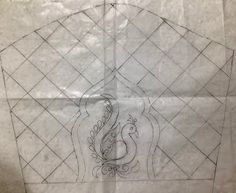 a piece of paper with a drawing of a peacock on it's back side