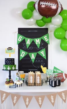 a football themed party with green and white balloons