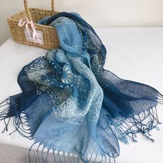 100% linen scarf in natural colors is perfect for all seasons - cool in summer and comfortable in the fall. It's lightweight, soft, and has a beautiful pattern with delicate twisted tassel ends. -100% light weight linen - Hand died, color and pattern may vary slightly -Rectangle: 185*60cm/73*24 inch without tassels -Three color/patterns: * Blue totem * Blue flax flowers * Blue Dots in frame Care: Hand wash in 80F/30C degrees water. Dry flat. Linen softens with washing. Don't dry clean. Don't tum Casual Linen Scarves For Summer, Blue Cotton Summer Scarves, Blue Bohemian Silk Scarf For Spring, Bohemian Linen Scarves For Spring, Bohemian Blue Silk Scarf For Spring, Blue Bohemian Shawl For Summer, Bohemian Linen Shawl, Casual Blue Silk Scarf For Spring, Blue Bohemian Scarf With Natural Dye