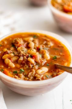 a white bowl filled with chili and beans