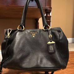 100% Authentic Purchased From Prada Inside Saks Ny I Paid $1,927.09 Gorgeous Black Caviar Pebbled Leather Gold Hardware Removable Shoulder Strap Approximately 13.5” X 10.25” Expands To 19” 6” Wide Most Signs Of Wear Are To Handles Which Can Probably Be Touched Up . Lining Looks Clean And There Are No Rips This Bag Is Still In Great Condition But Is Used So Don’t Expect A Brand New Looking Bag. I Included Many Photos Which You Can Zoom Into See All Details All Zippers And Snaps Work Chic Pre-owned Leather Bag, Designer Pre-owned Bags, Luxury Pre-owned Bags, Black Leather Purse, Black Caviar, Louis Vuitton Speedy Bag, Prada Bag, Kate Spade Top Handle Bag, Womens Tote Bags