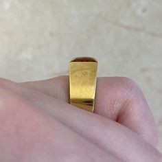 This unique ring features a natural citrine stone in a square cut. This ring is handcrafted in 18k yellow gold and signed by Cartier.
The approximate measurements of the citrine are 8.06mm x 7.92mm x 5.50mm.
This ring is currently sized at 5 and can be resized at no additional cost.
Ready to Make It Yours? Contact us to reserve this ring and to get more info! Classic Gold Ruby Ring With Rectangular Shape, Classic Gold Rectangular Ruby Ring, Modern Yellow Gold Topaz Ring With Polished Finish, Classic Rectangular Ruby Ring In Gold, Modern Gold Topaz Ring, Elegant Formal Citrine Signet Ring, Elegant Citrine Signet Ring For Formal Occasions, Modern Gold Princess Cut Ring, Modern Yellow Gold Square Cut Ring