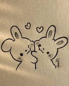 two mouses with hearts drawn on them