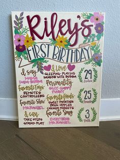 a sign that says riley's first birthday with flowers and leaves on the front