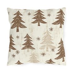 a white pillow with brown trees on it