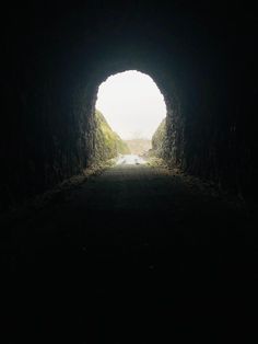 a dark tunnel with light at the end