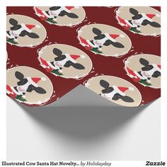 a red wrapping paper with black and white dogs wearing santa's hats on it