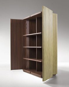 an open wooden cabinet with shelves on both sides