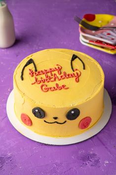 vegan pikachu pokemon cake with a birthday message written on top Pikachu Cake Ideas, Pikachu Birthday Cake, Pokemon Torte, Pokemon Birthday Party Ideas, Pokemon Birthday Cake, Pikachu Cake, Swirl Cake, Pokemon Cake, Pokemon Birthday Party