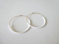 These hoops are gold filled and they have dainty and high quality white seed beads. Also available with sterling silver, 14kt gold and 14kt rose gold (choose preference at checkout). ❤ SIZES They measure 45 mm in diameter. ❤ PROCESSING AND SHIPPING Most orders are made and shipped out in one business day. Please check delivery timeframes for your location on the description below. ❤ CUSTOM ORDERS Contact me to discuss you needs! Go back to my shop: https://www.etsy.com/shop/StephanieMartinCo See White 14k Gold Filled Hoop Earrings, White 14k Gold Filled Hoop Jewelry, White Round Bead Earrings For Everyday, Handmade White 14k Gold Filled Hoop Earrings, Handmade 14k Gold Filled White Hoop Earrings, Handmade White Beaded Earrings For Everyday, Everyday Handmade White Beaded Earrings, Minimalist Small Hoop White Jewelry, White Minimalist Round Hoop Earrings