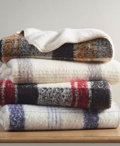 three blankets stacked on top of each other