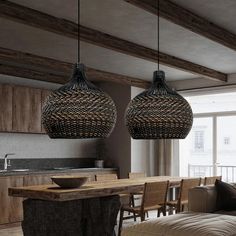 two lights hanging from the ceiling in a living room