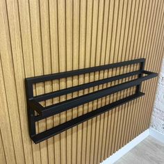 a wall mounted shelf on the side of a building