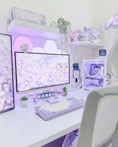 a white desk with a computer monitor and keyboard