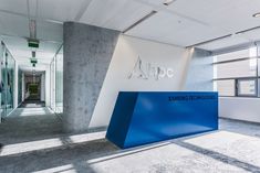 the entrance to an office building with blue and white signage that says apo on it