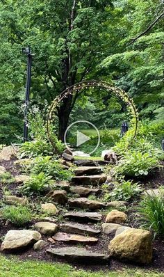 a stone path surrounded by lush green trees