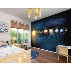 the solar system wall mural in a child's bedroom with wooden floors and furniture