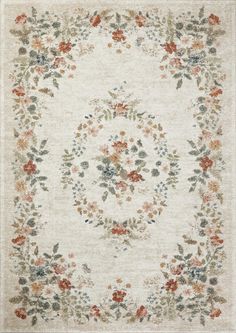 an area rug with flowers and leaves on the border, in cream color palettes