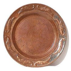 a brown plate with an intricate design on it