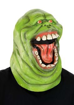 a man wearing a green monster mask with his mouth open and teeth wide open to the side