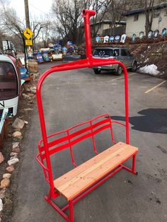 a bench sitting in the middle of a parking lot