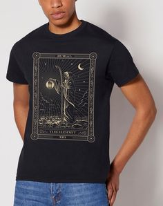 a man wearing a black t - shirt with an image of the moon