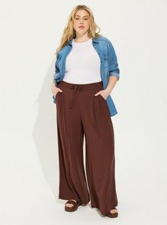 FIT High rise. Wide leg silhouette. . 30” inseam. . MATERIALS + CARE Washable Gauze woven fabric: The lightweight, breathably soft fabric you love is, at last, wash, wear and go! . Stretch level: None. 74% rayon, 26% polyester. Machine wash cold. Tumble dry low. Imported. DETAILS Pull-on elastic waistband. Drawstring detail. . The best plus size women's long, tall pull-on wide leg washable gauze high rise pant pants in deep mahogahny made of washgauze. Rock your look from Torrid to Festivals lik Wide Leg Chambray Pants Outfits, Casual Rayon Bottoms For Fall, Clothing Silhouettes, Simple Plus Size Outfits, Professional Outfits Women Plus Size, Plus Size Teacher Outfits, Teacher Clothing, Gauze Pants, Drawstring Detail