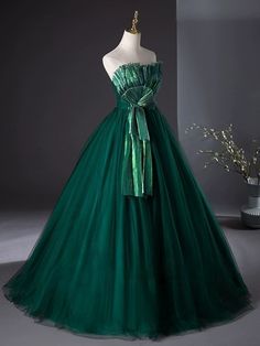 Step into a world of glamour with our Emerald Green Ball Gown with Luminous Pleated Accents - Green Evening Dress Plus Size. Crafted from rich, emerald fabric, this gown features a fitted bodice that gracefully transitions into a voluminous pleated skirt, creating a striking silhouette that commands attention. The pleats are intricately designed to catch and reflect light, giving the gown a luminous quality that enhances its luxurious appeal. Perfect for formal events or as an unconventional bridal option, this dress is designed to ensure you shine throughout the evening. With its perfect fit and exquisite detailing, it offers both comfort and elegance, making every moment unforgettable. Emerald Green Ball Gown, Victorian Style Wedding Dress, Evening Dress Plus Size, Emerald Fabric, Antique Wedding Dresses, Victorian Style Wedding, Green Ball Gown, Ball Gown Prom Dress, Nontraditional Wedding Dress