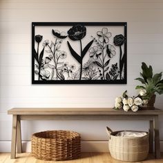 a wooden bench sitting next to a wall with flowers on it and a basket underneath