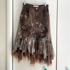 Rossi Roma Brown Denim Layered Ruffle Sequin Midi Skirt. Embroidered Flowers And Paisleys With Sequin Detailing. Raw Hem Lace Ruffle. Some Wear To The Lace/ Ruffle Bottom But Otherwise And Great Condition. Size Small **Matching Denim Top Available** Material: 76% Cotton, 14% Nylon, 10% Elastane Waist: 27 Inches Approx Length: 30.75 Inches Approx Tags Y2k Vintage Rare Coquettegirl Romantic 90s Maximalism Lace Layered Skirt Edgy Fall Autumn Jean Skirt Free People Like Anthropologie Like Urban Outf Jean Skirt With Lace, 90s Maximalism, Tattered Skirt, Tool Skirt, Patch Skirt, Sequin Maxi Skirt, Dolly Christmas, Maxi Sequin Skirt, Unique Skirt