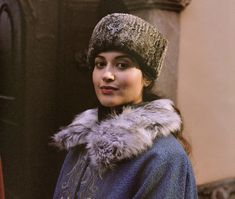 a woman wearing a fur hat and coat