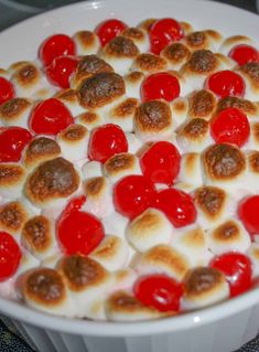 a dessert with cherries and marshmallows in a bowl