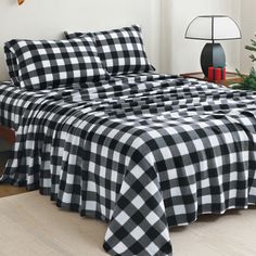 a black and white checkered bedspread on a bed