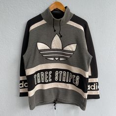 Details: *Vintage adidas sports gear descente black & white color stripes sweatshirt  *Measurements:    Size Large -Chest (armpit to armpit) : 22 inches / 55.9 cm -Length (collar to bottom hem) : 27 inches / 68.6 cm *condition 8/10. No rips or hole, only got slightly faded at the black color. Everything else is good! ------------------------------------------ After purchase please leave phone number for shipping will ship using Fedex/DHL express  (Estimated to arrive 4-7 days only) If you have any questions regarding the item, feel free to contact any time. Customer satisfaction is our priority! Check out my other items & follow - new arrivals every day! https://kedainasvintage.etsy.com Pull Adidas Vintage, Sweat Adidas Vintage, Adidas Vintage Hoodie, Adidas Vintage Sweatshirt, Retro Adidas Sweatshirt, Sweat Vintage, Adidas Vintage, Striped Sweatshirts, Adidas Sport