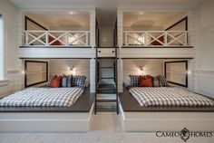 two bunk beds in a room with white walls