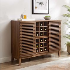 a wooden cabinet with wine bottles on it