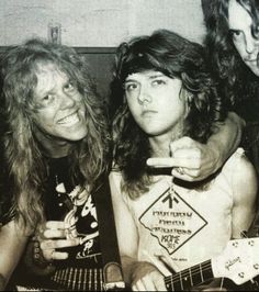 three young people posing for a photo in black and white