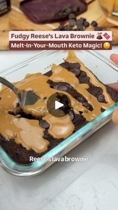 someone is cutting into a chocolate cake with caramel icing on it and the words fudge reese's lava brownie melt in your - in - your - mouth keto magic