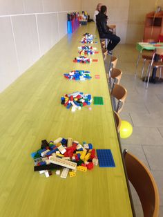 a long table with legos on it in a room