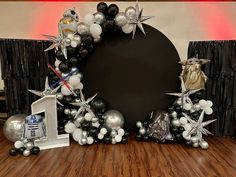 star wars balloon arch with silver and black balloons