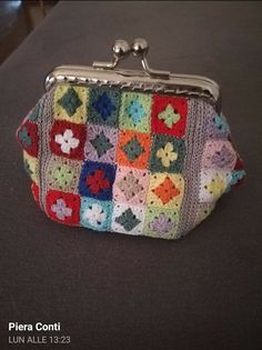 a crocheted purse sitting on top of a table