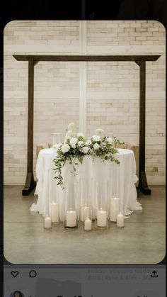 a table with candles and flowers on it