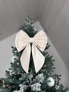 a christmas tree with a bow on it