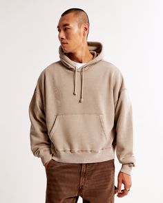 Elevate your casual wardrobe with the Men's Essential Cropped Popover Hoodie from Abercrombie & Fitch. This stylish piece is not just a hoodie; it's a statement of comfort and fashion.

- **Size**: Medium
- **Color**: Light Brown
- **Material**: Cotton, Polyester blend
- **Gender**: Male
- **Features**: Oversized, cropped fit; softAF fabric; exterior drawcords; front pouch pocket; banded hem and cuffs

Crafted in a unique oversized and cropped silhouette, this hoodie is made from our exclusive s Comfy Relaxed Fit Sweats With Drawstring Hood, Relaxed Fit French Terry Sweatshirt With Kangaroo Pocket, Relaxed Fit Sweatshirt With Kangaroo Pocket In French Terry, Fall Sweatshirt With Adjustable Hood And Relaxed Fit, Relaxed Fit Sweatshirt With Adjustable Hood For Fall, Relaxed Fit Fall Sweatshirt With Adjustable Hood, Cozy Hoodie In French Terry With Relaxed Fit, Cozy Relaxed Fit Hoodie In French Terry, Relaxed Fit Fleece Hoodie With Drop Shoulder