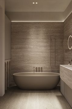 a bathroom with a large bathtub next to a sink and mirror on the wall